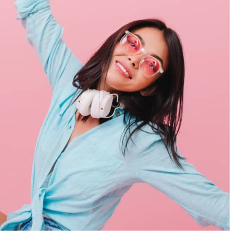 a happy girl in pink glasses